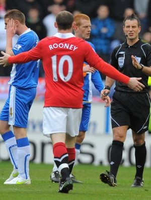 Rooney Manchester United Wigan (Foto: AFP)