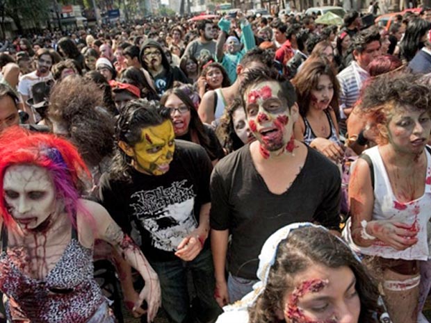 Mexicanos se vestem de mortos-vivos para participar da 'caminhada zumbi', festa à fantasia temática que acontece em vários países
