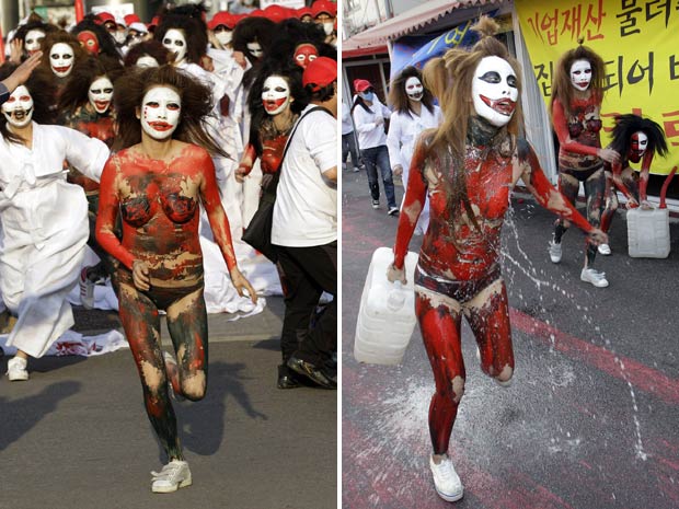 Prostitutas correm pelas ruas com os corpos pintados e usando apenas calcinhas em Seul (Foto: AP)