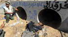 FOTOS: líbio mostra suposto local da captura (AFP)